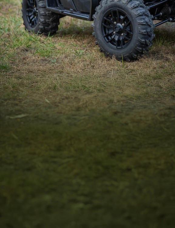 Pioneer 1000 Deluxe on a farm track
